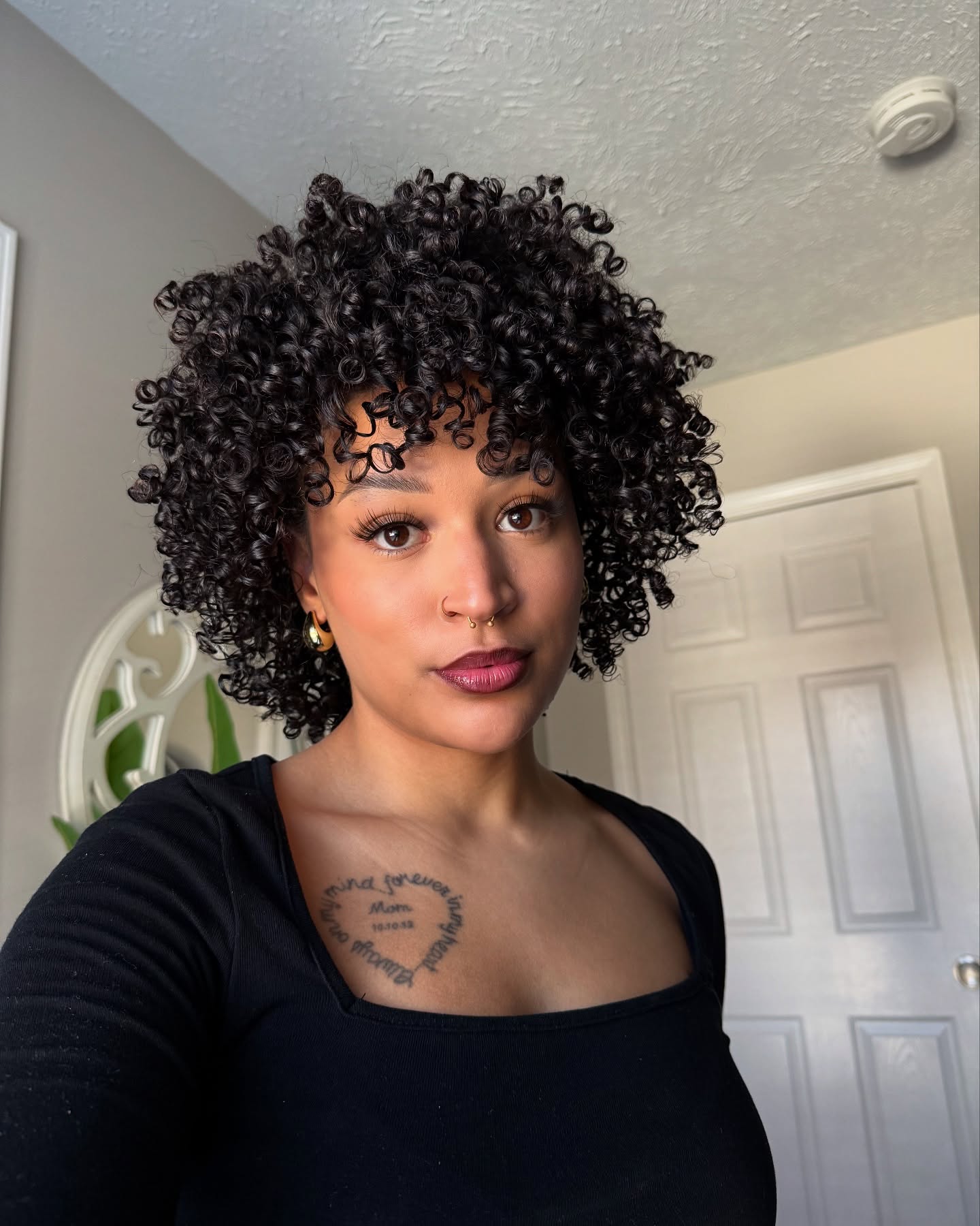 10. Curls That Command Attention: the Bold Crown with Whimsical Bangs