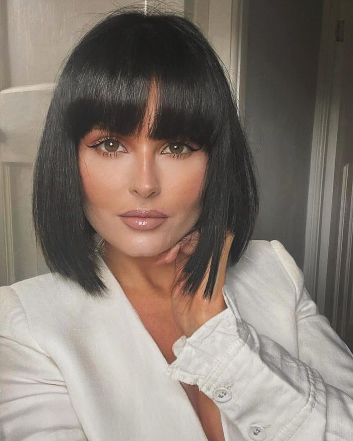 38. Smooth Straight Bob with Blunt Bangs