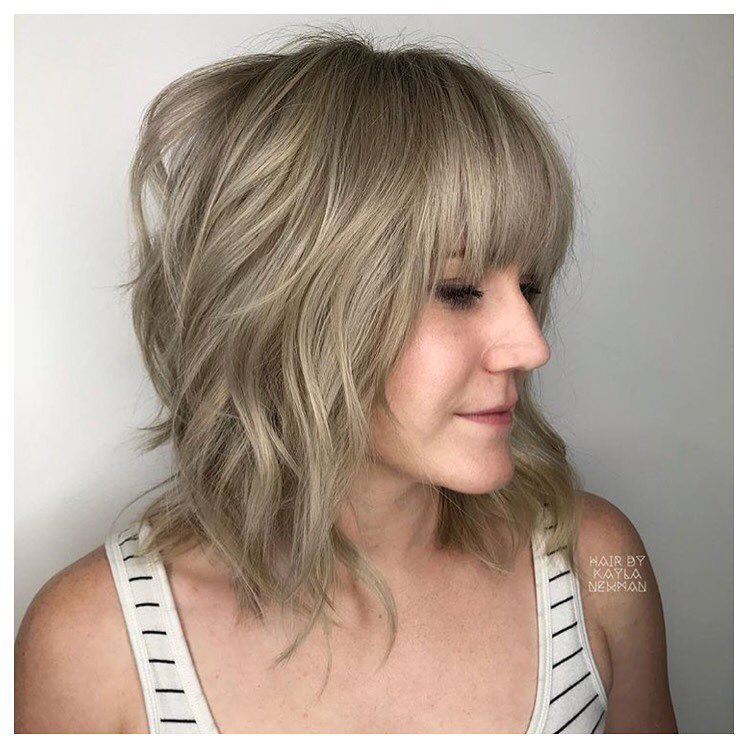 1. Tangled Elegance: the Art Of Feathered Shag with Playful Fringe