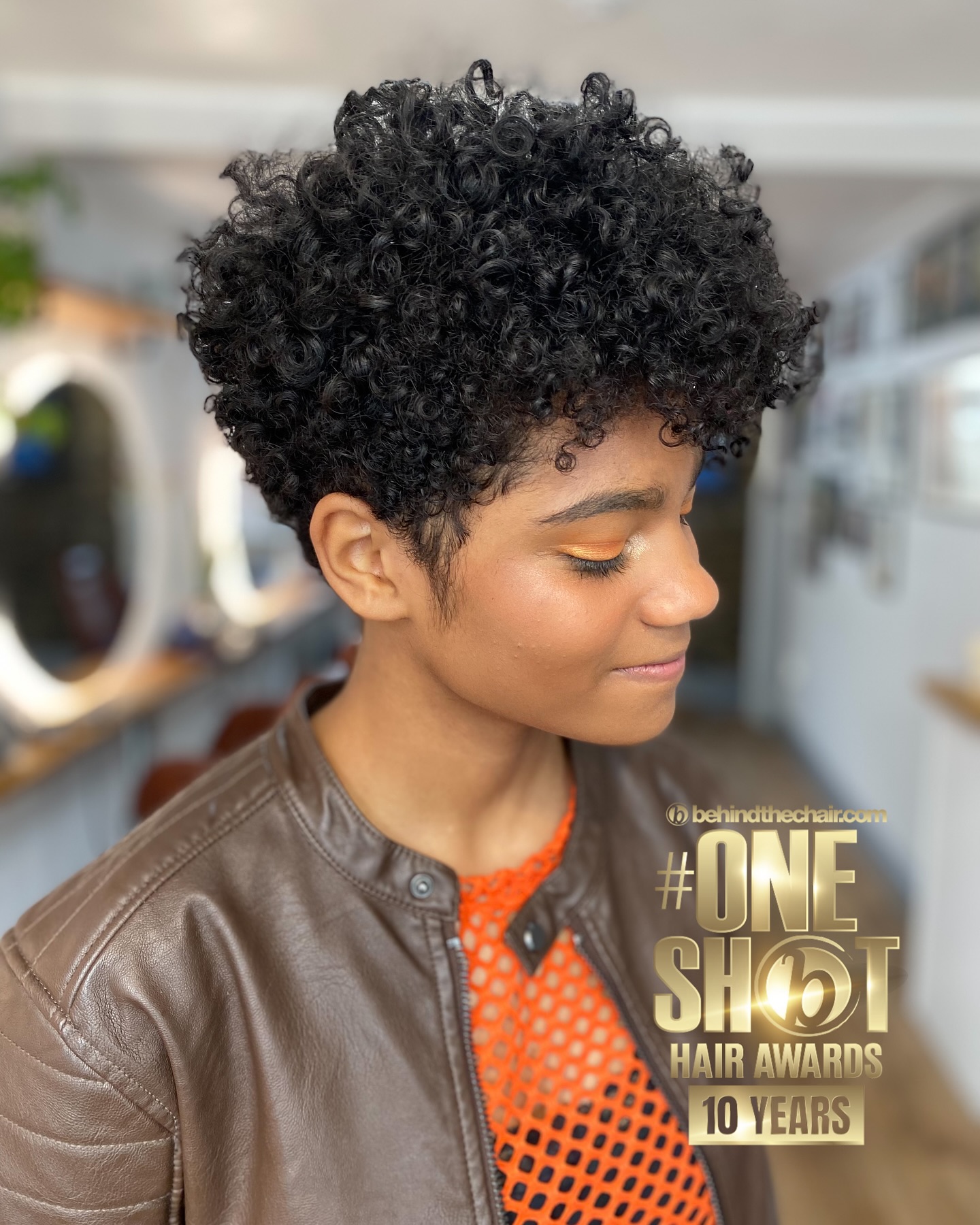 42. Curly Chic: Embracing the Bold and Textured with Trompe-l'œil Bangs