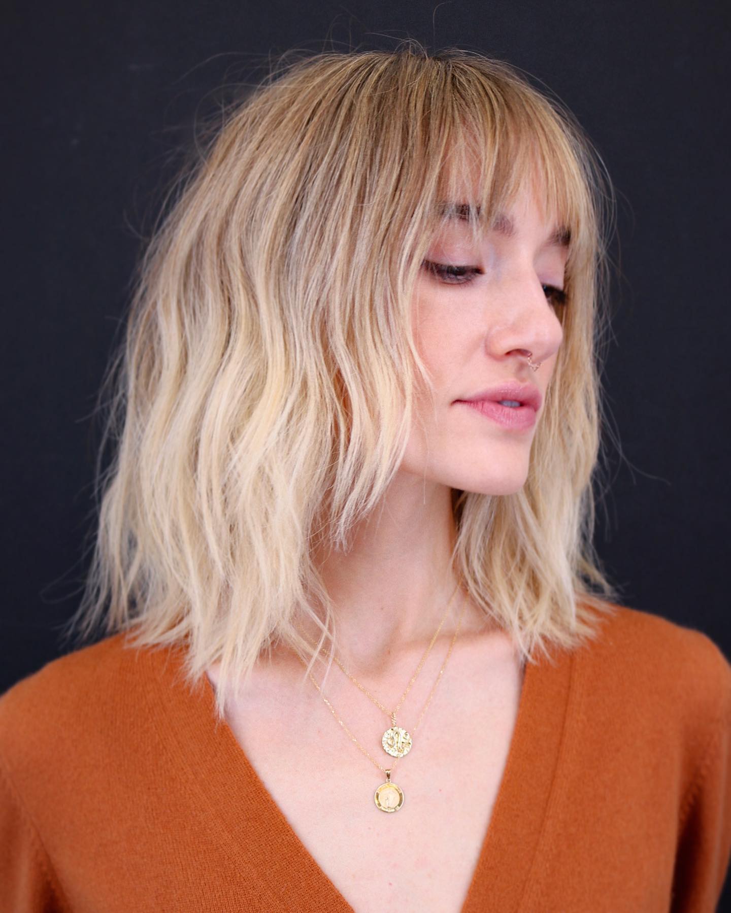 31. Sun-kissed Shag with Flirty Fringe