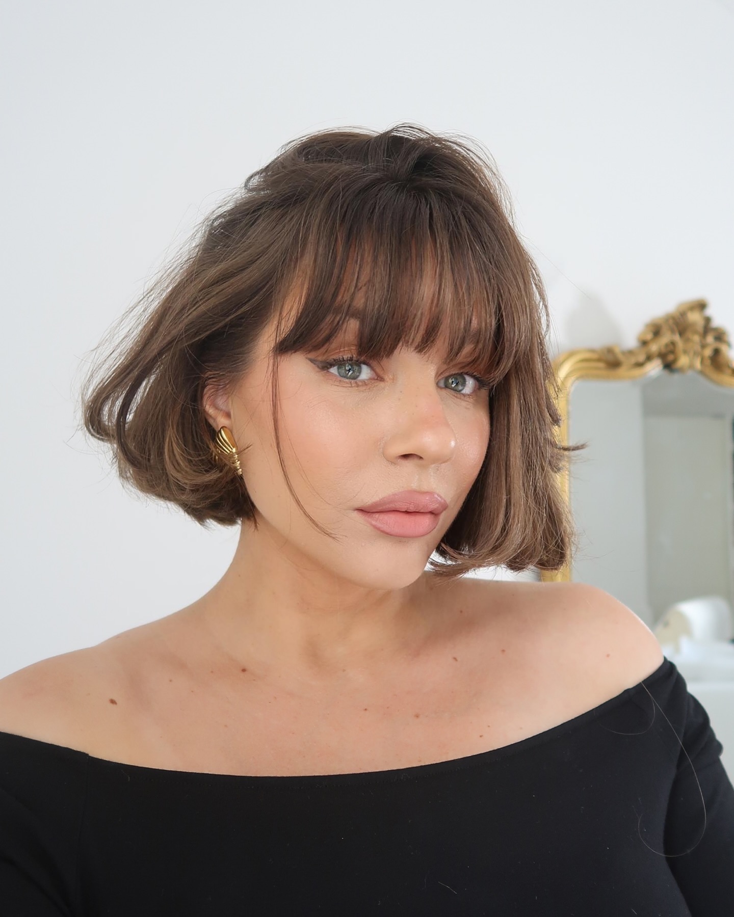 10. Bob Cut with Soft Bangs and Textured Layers