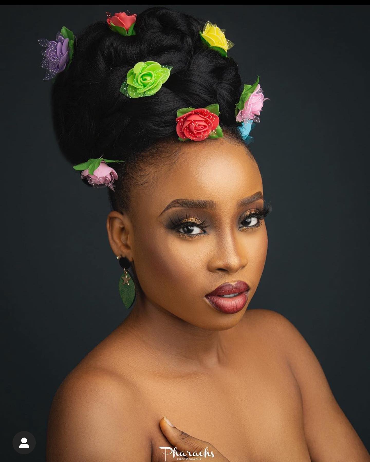 45. Floral Fantasy: a Whimsical Updo for the Bold and Beautiful