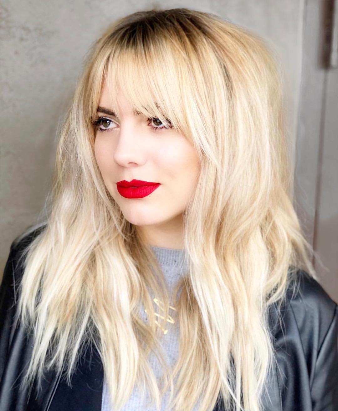 49. Golden Hour Shag: the Effortlessly Chic Blend Of Fluffy Texture and Sharp Bangs