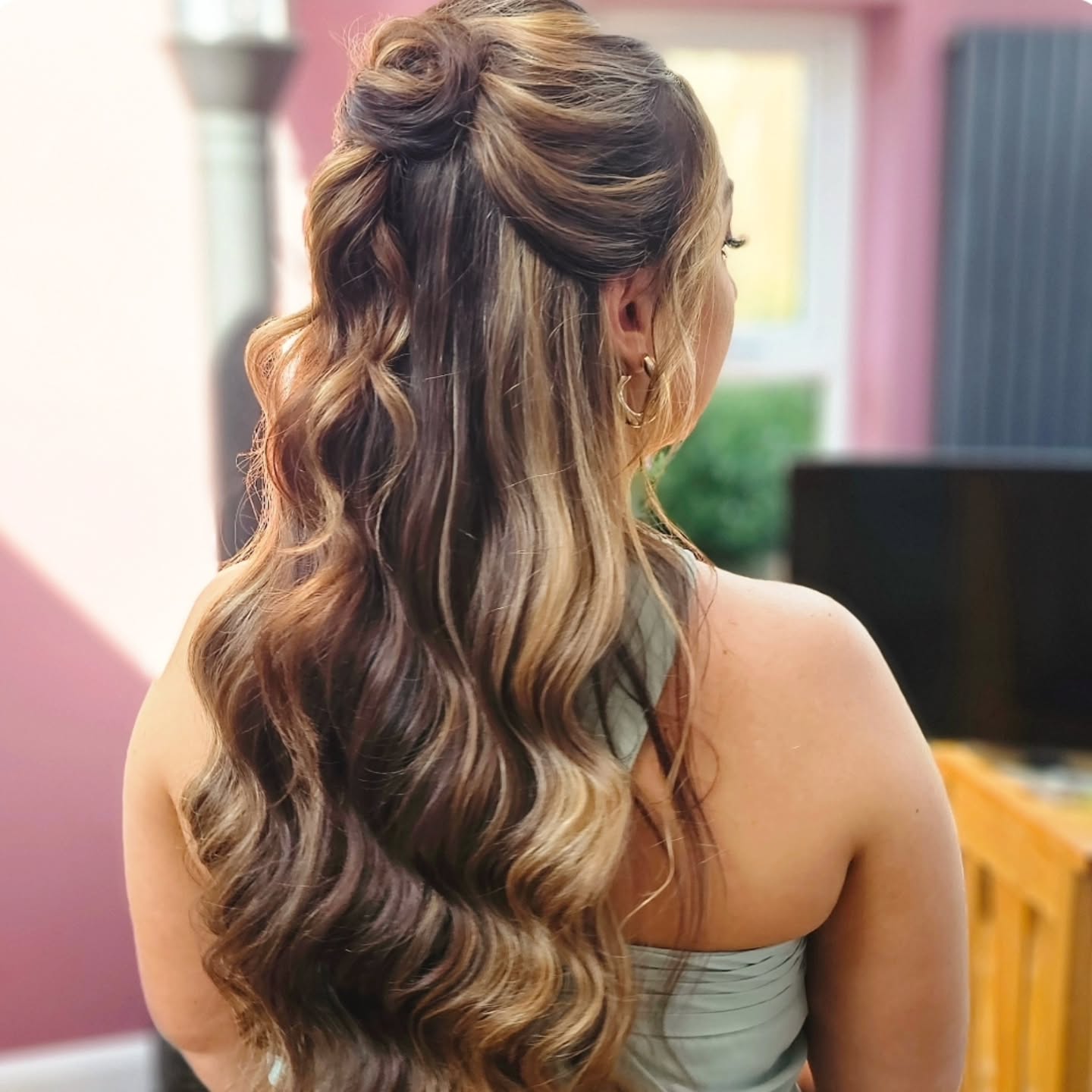 23. Twisted Elegance: a Regal Half-up with Flowing Waves