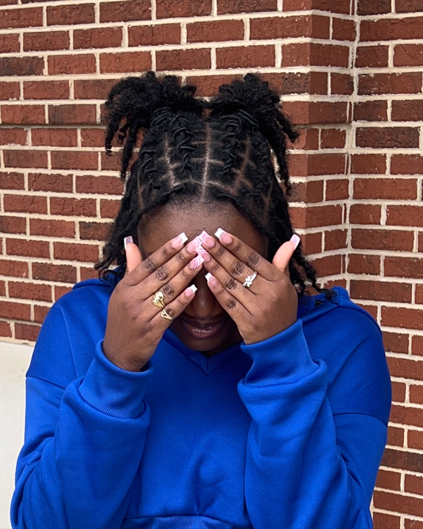 39. Cute Confections: Playful Double Buns with Detailed Twists