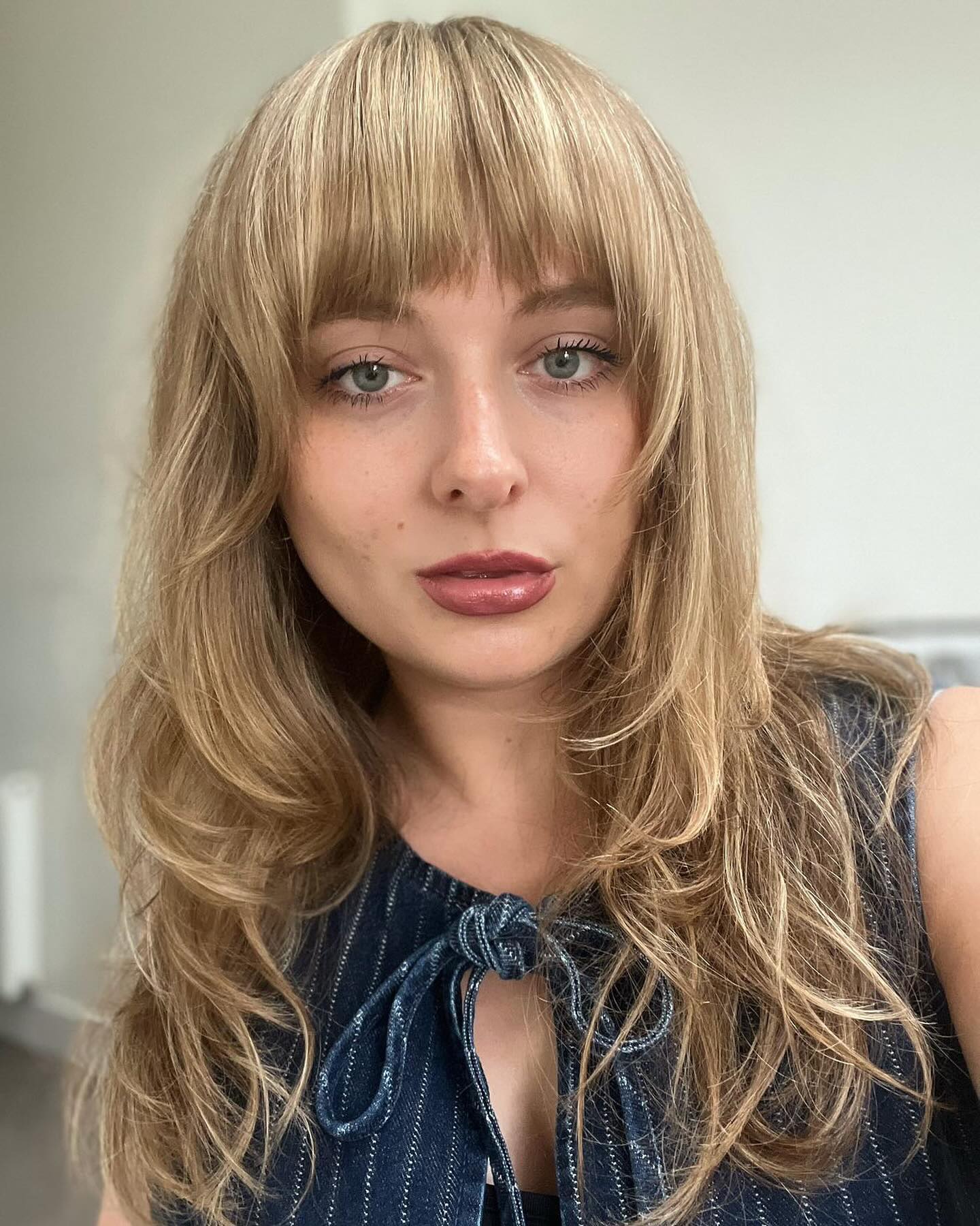 50. Luminous Shag with Chunky Bangs and Effortless Waves