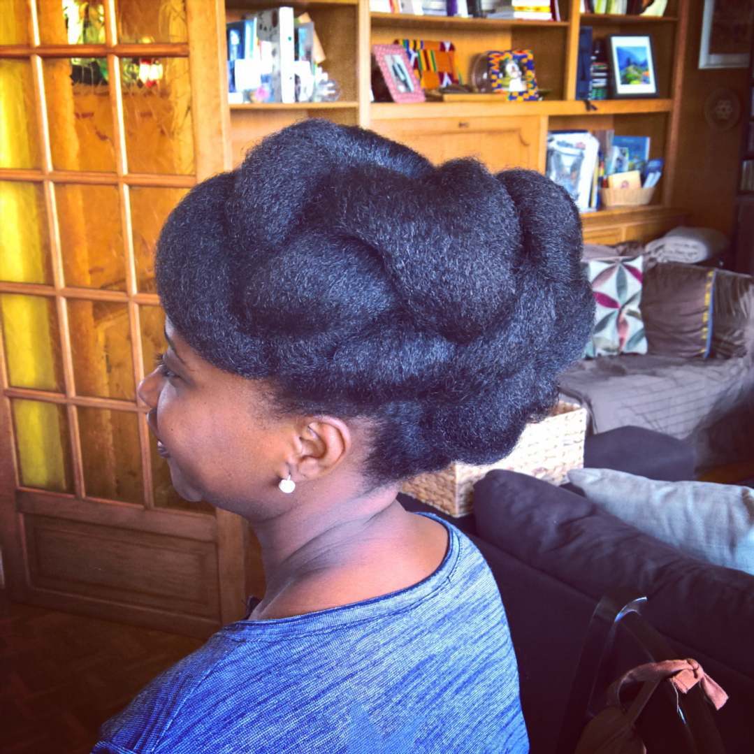 11. Elegant Twists Of Tradition: a Stunning Braided Updo for Prom