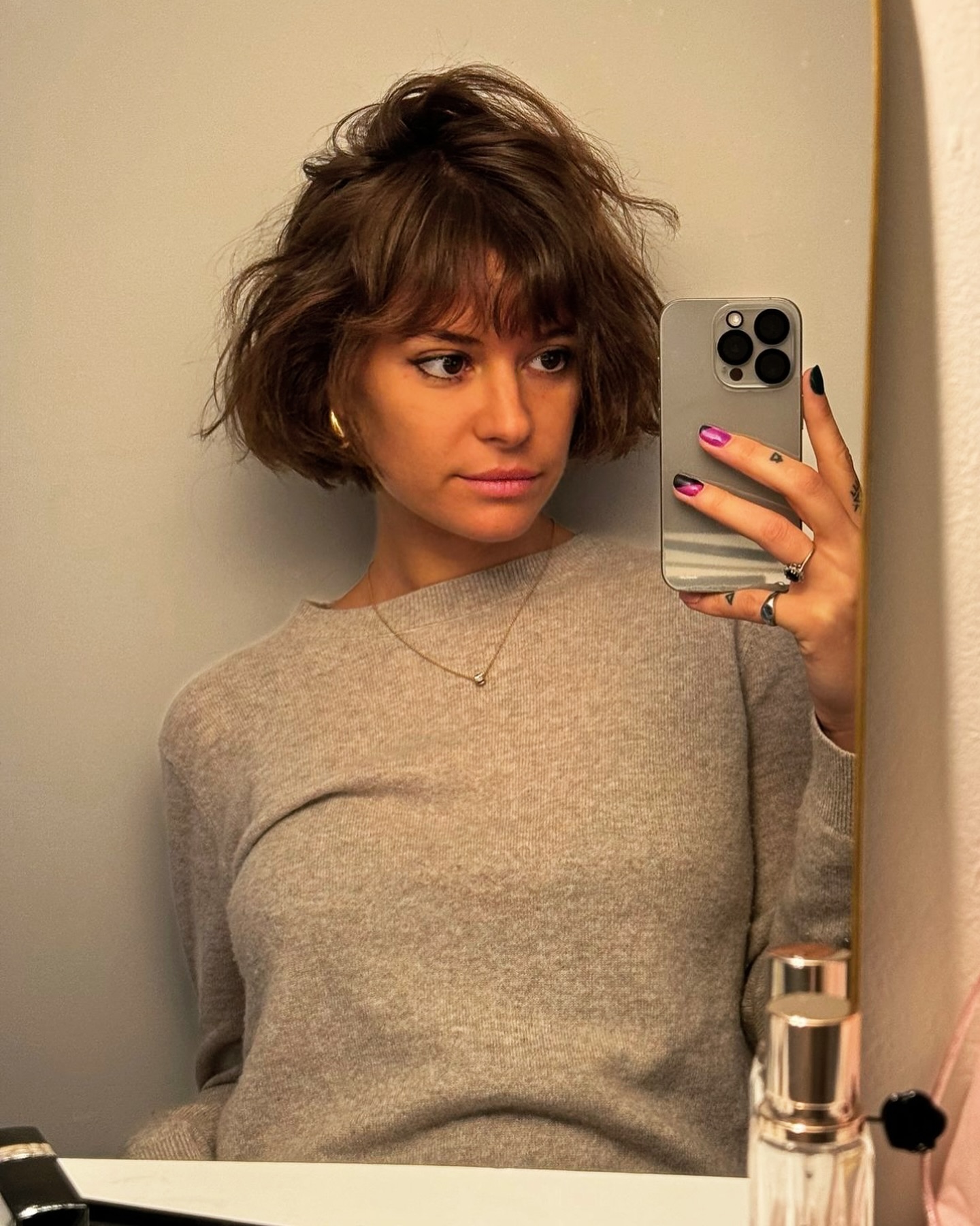 25. Chic Chaotic Charm: the Effortless Messy Bob with Side-swept Bangs