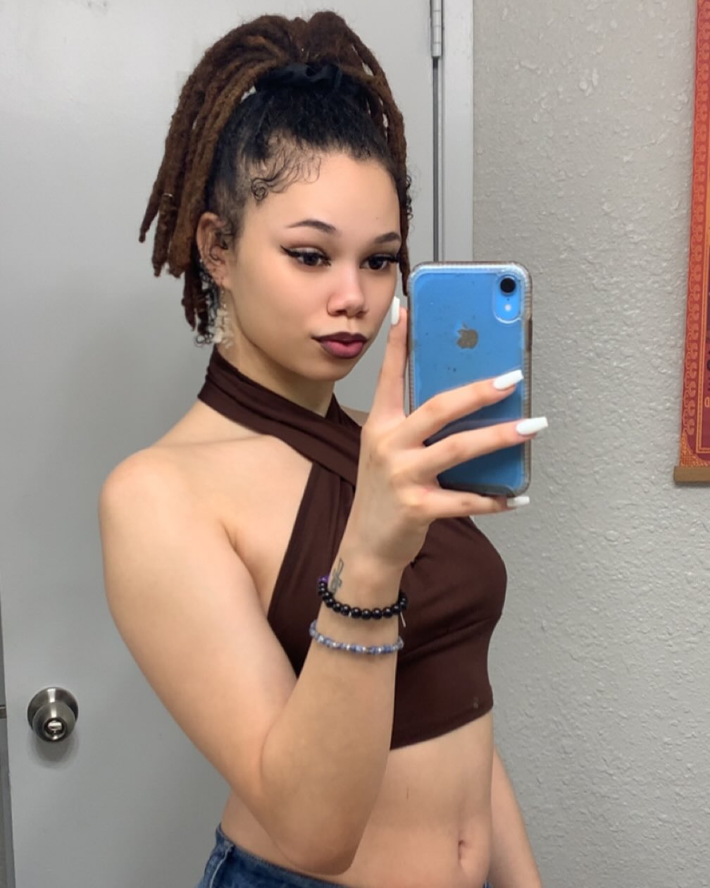 43. Dreaded Elegance: the Chic High Ponytail Twist
