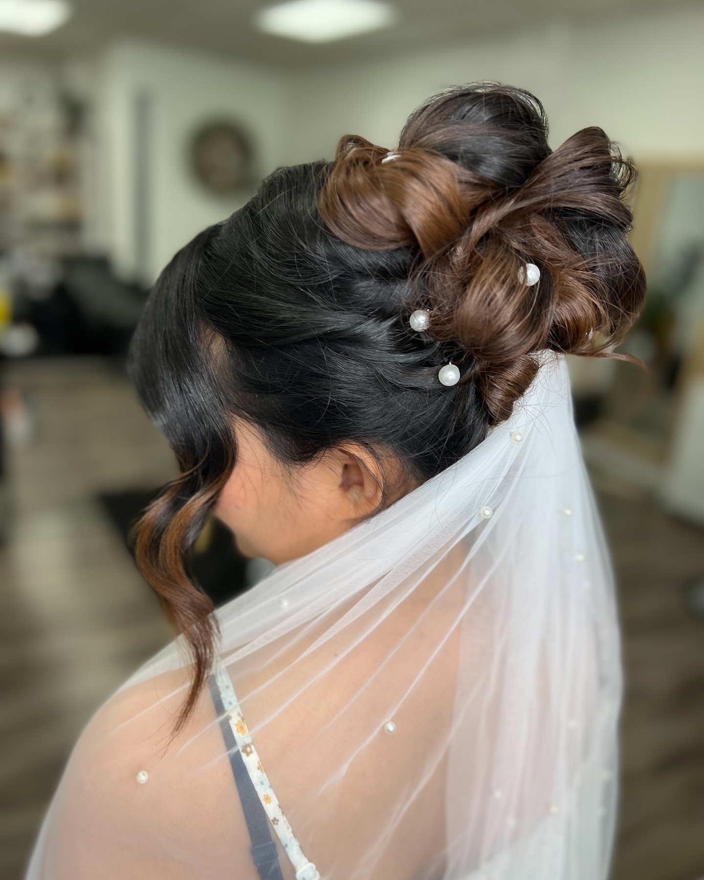 25. Whimsical Elegance: a Pearl-accented Twisted Updo