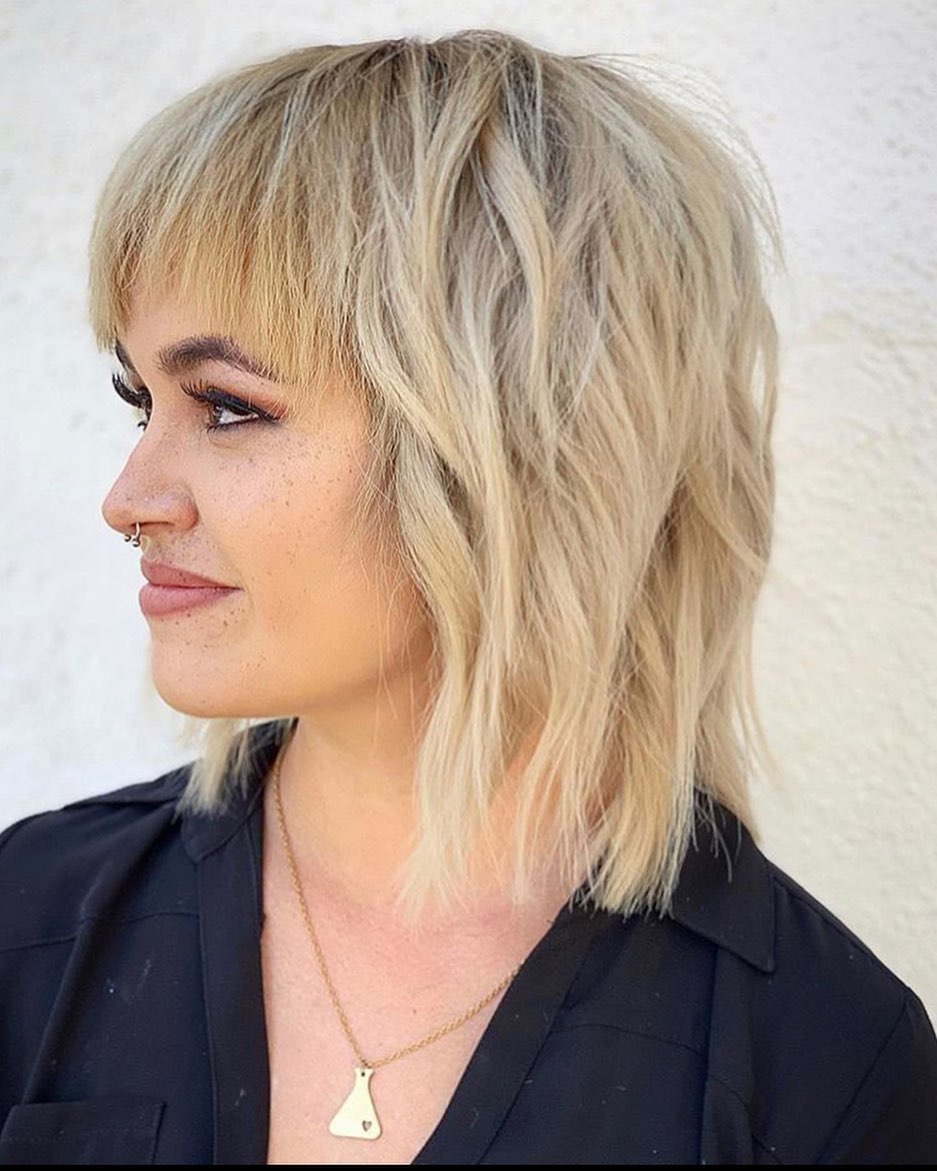 25. Choppy Layers and Playful Bangs: the Edgy Blonde Shag Reimagined