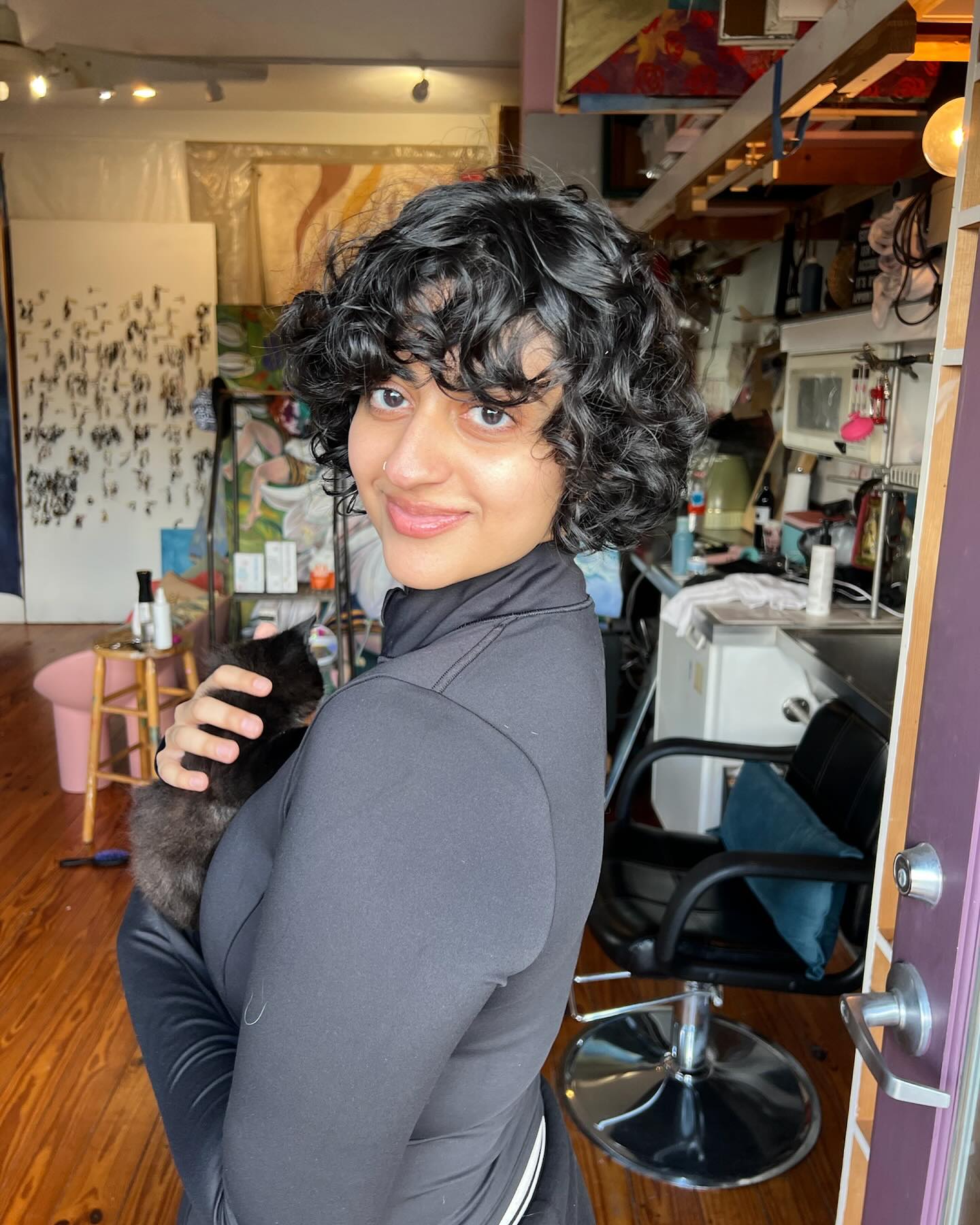 30. Wildly Whimsical Curls: Radiating Cheer with Playful Bangs