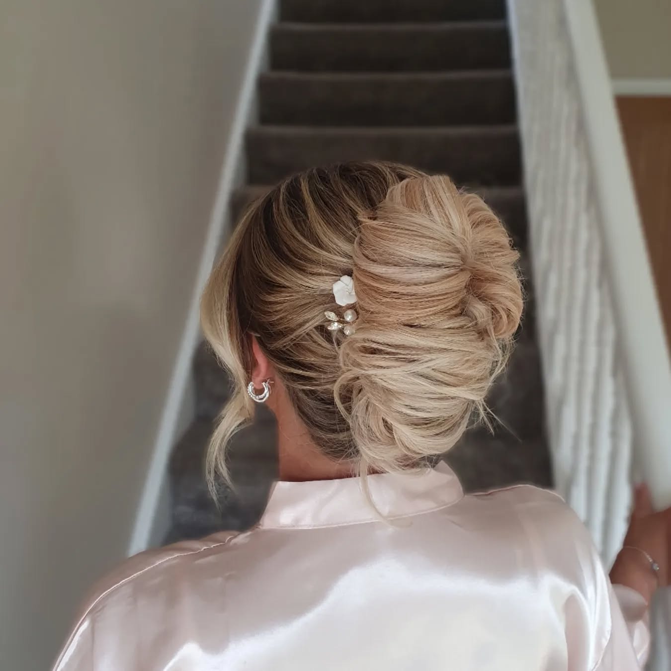 30. Timeless Twists: the Effortlessly Elegant Updo with a Pearl-embellished Flair