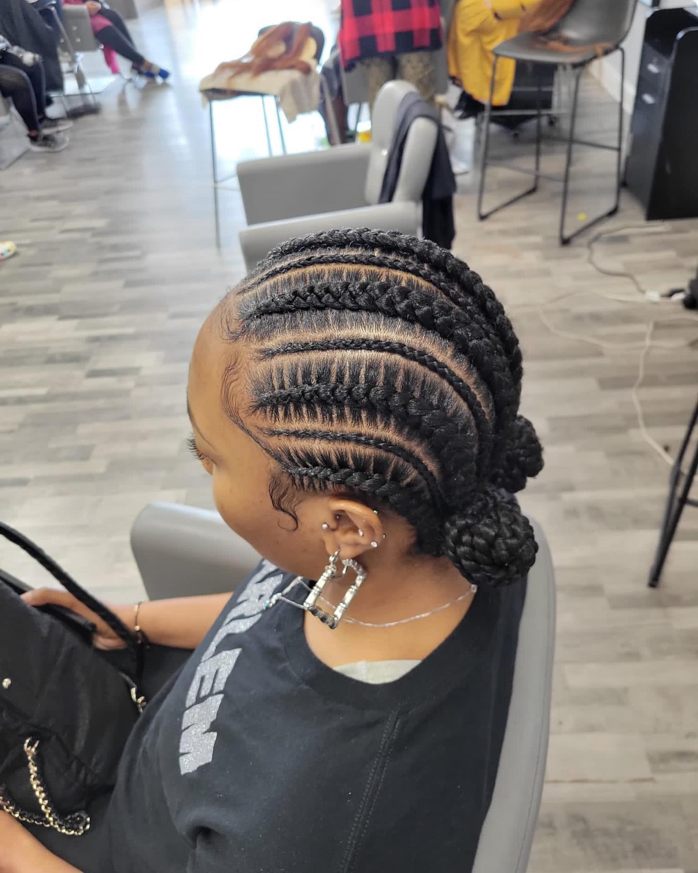 1. Braids with a Twist: Elevating Classic Box Braids with Enchanting Buns