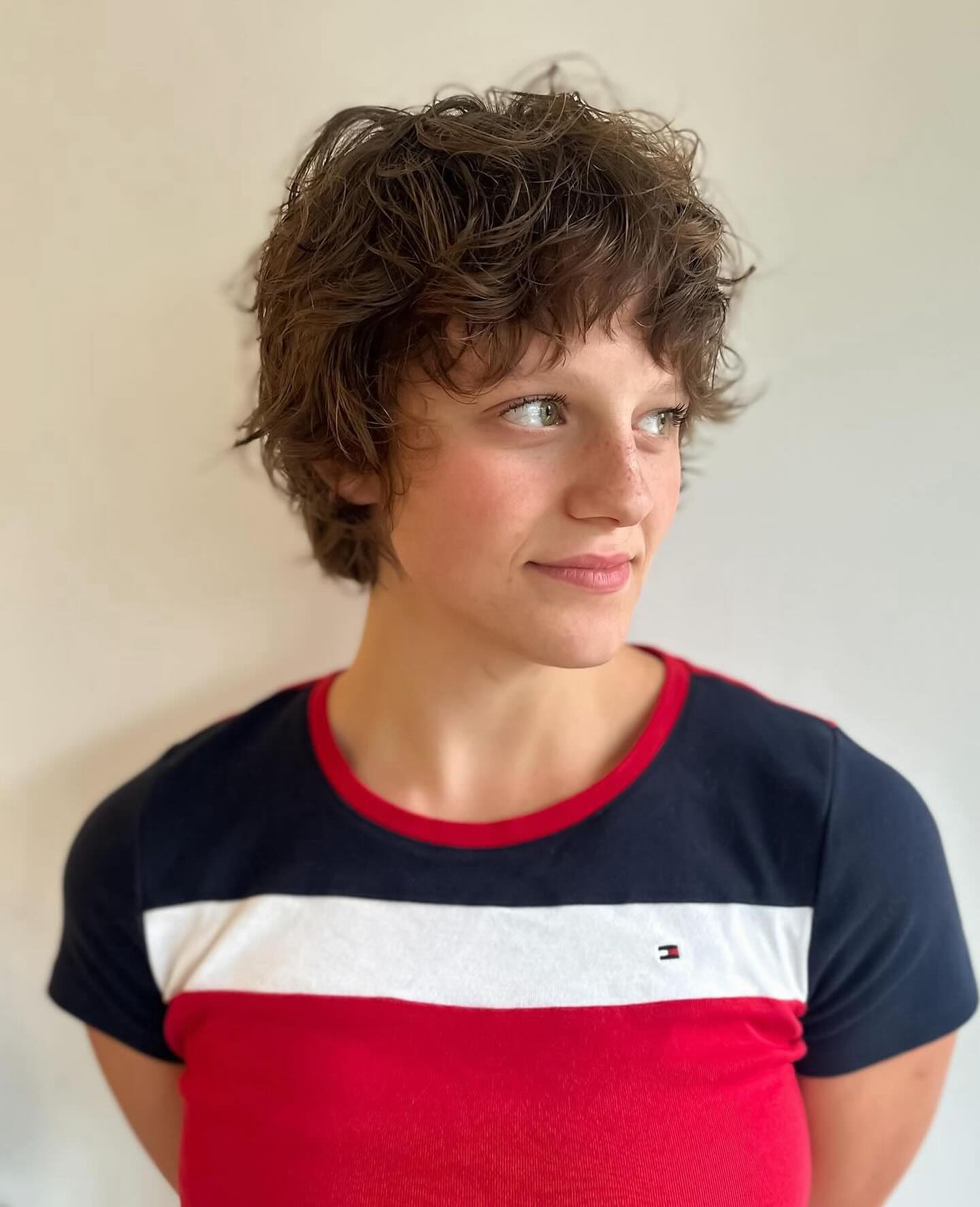 40. Curly Textured Charm: the Effortless Edge Of Playful Bangs