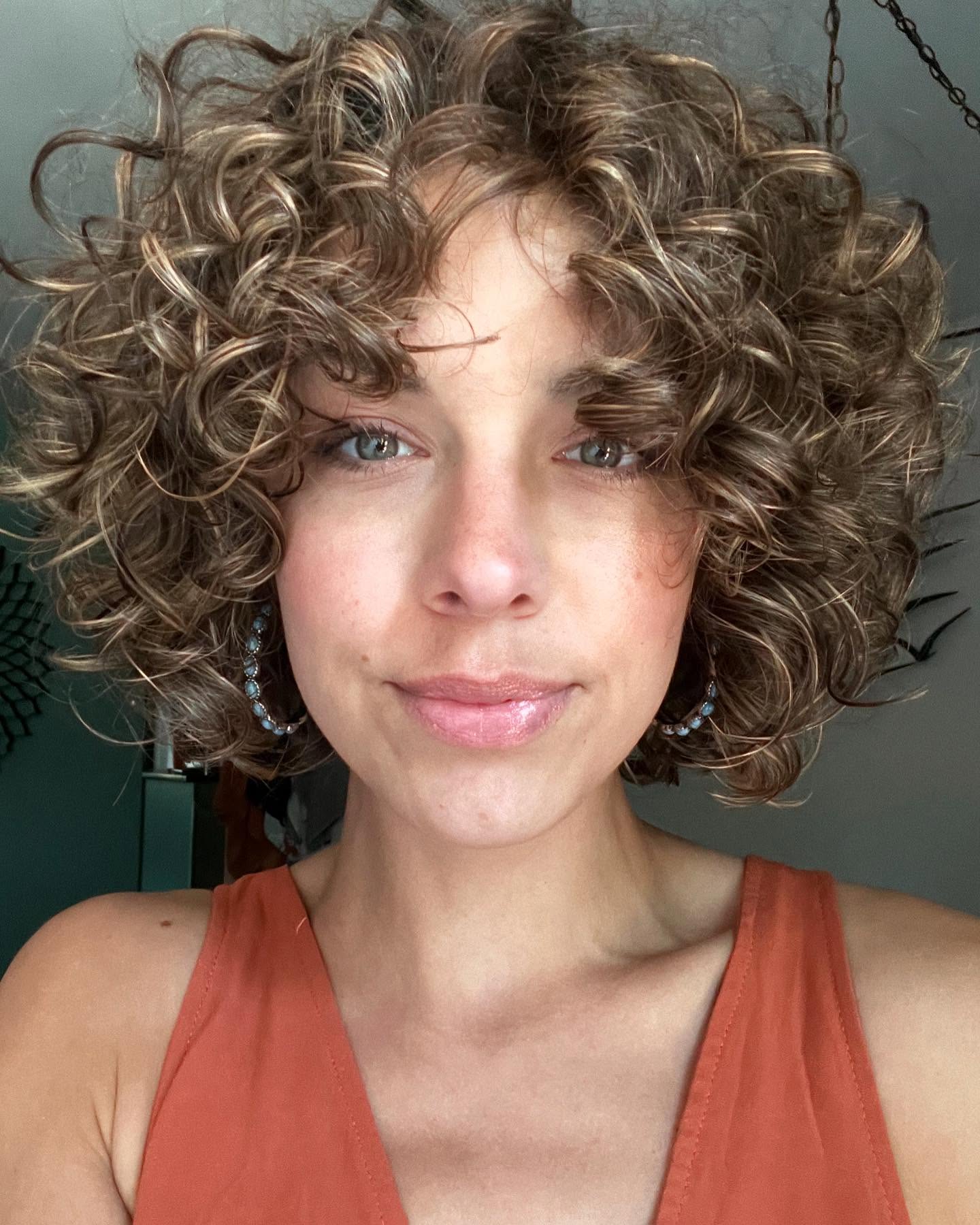 33. Curly Elegance with a Twist Of Sunlight