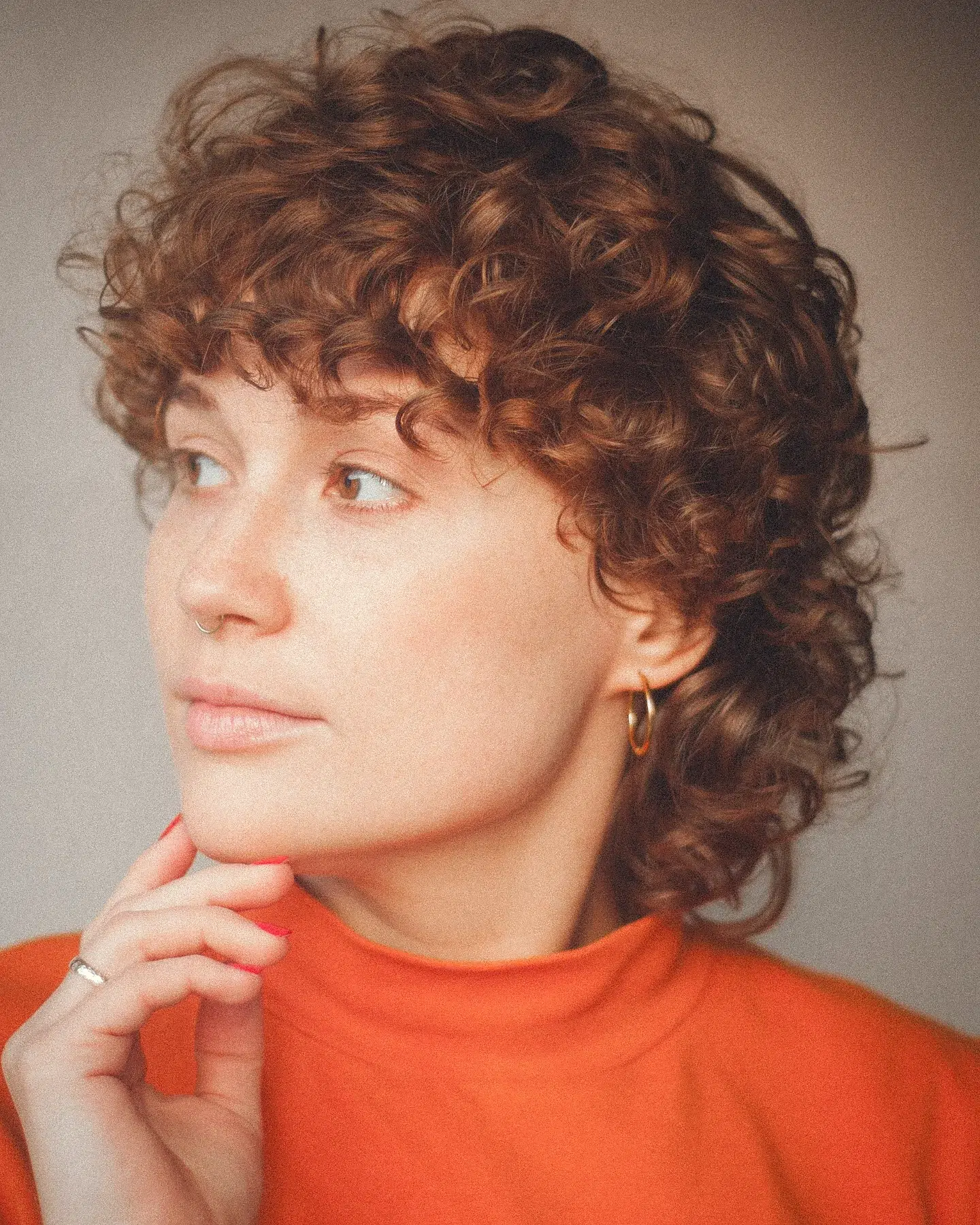 18. Cascading Curls with a Playful Edge: the Effortlessly Chic Look