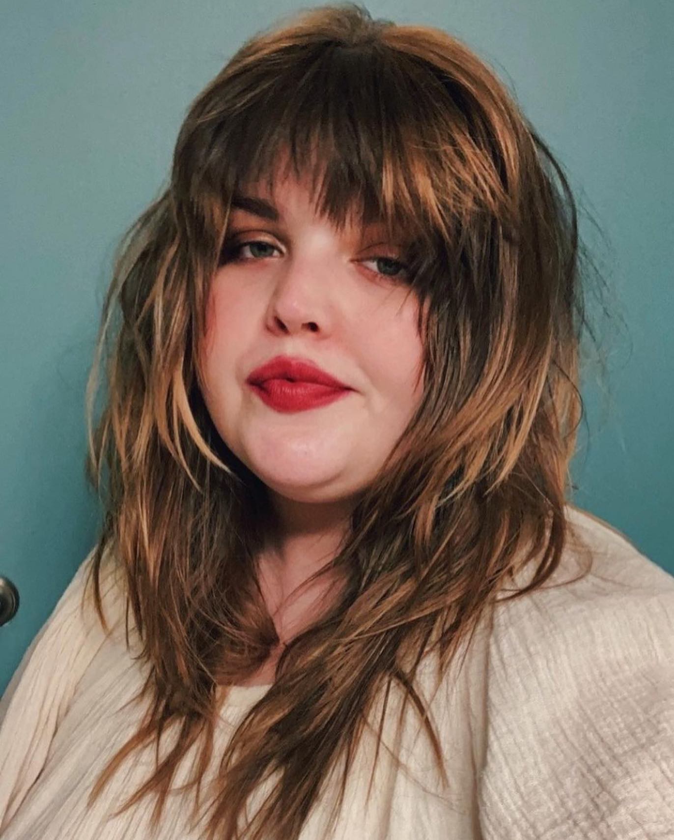37. Wildly Textured Layers with Edgy Curtain Bangs
