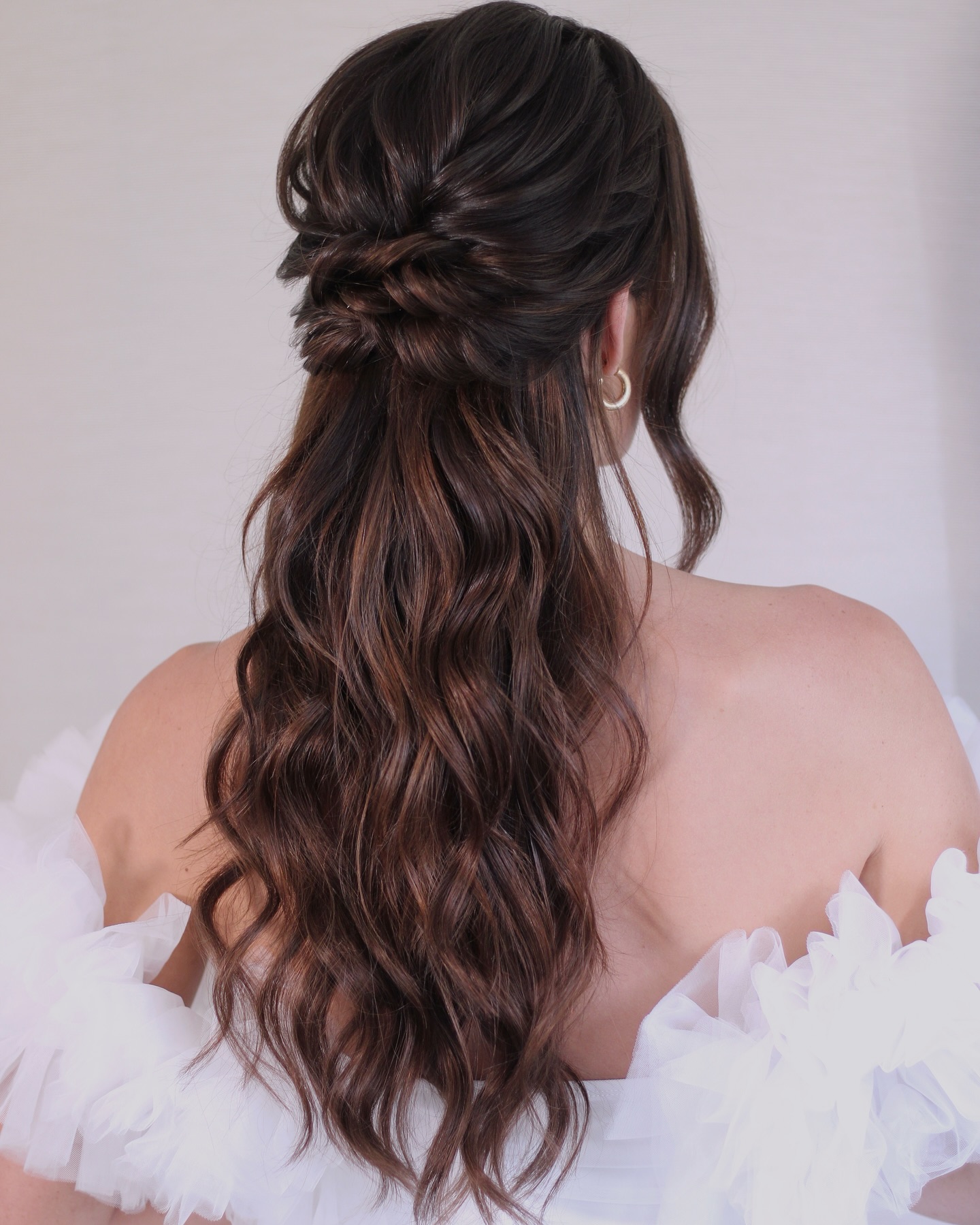 22. Effortlessly Romantic: Braided Half-up Elegance with Cascading Waves