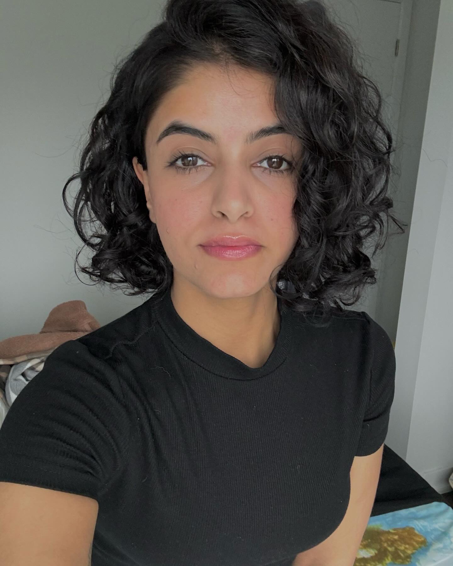 45. Curly Chic: Embrace the Effortless Elegance Of Textured Bangs