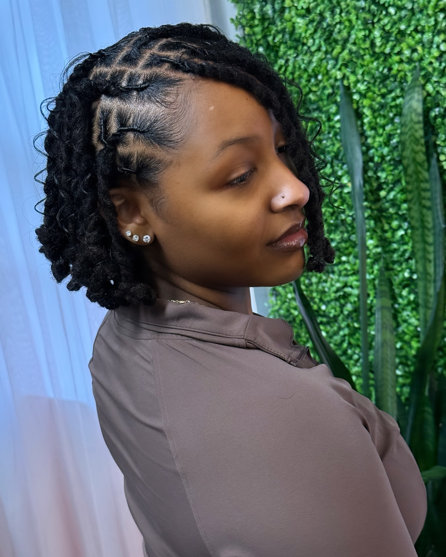 29. Framed Elegance: Intricate Twists with a Chic Bob