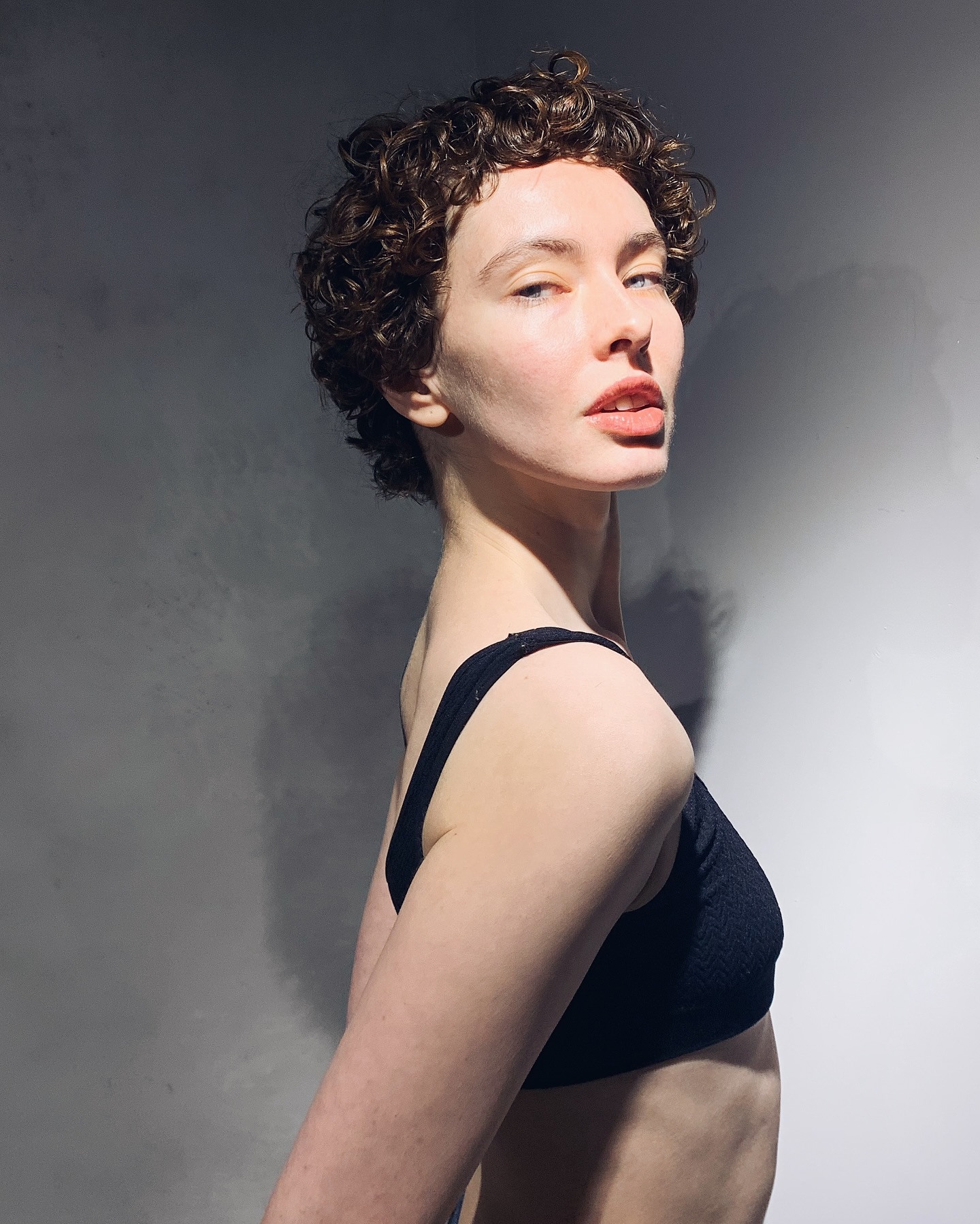 3. Ethereal Curls: the Bold Bangs That Define Modern Minimalism