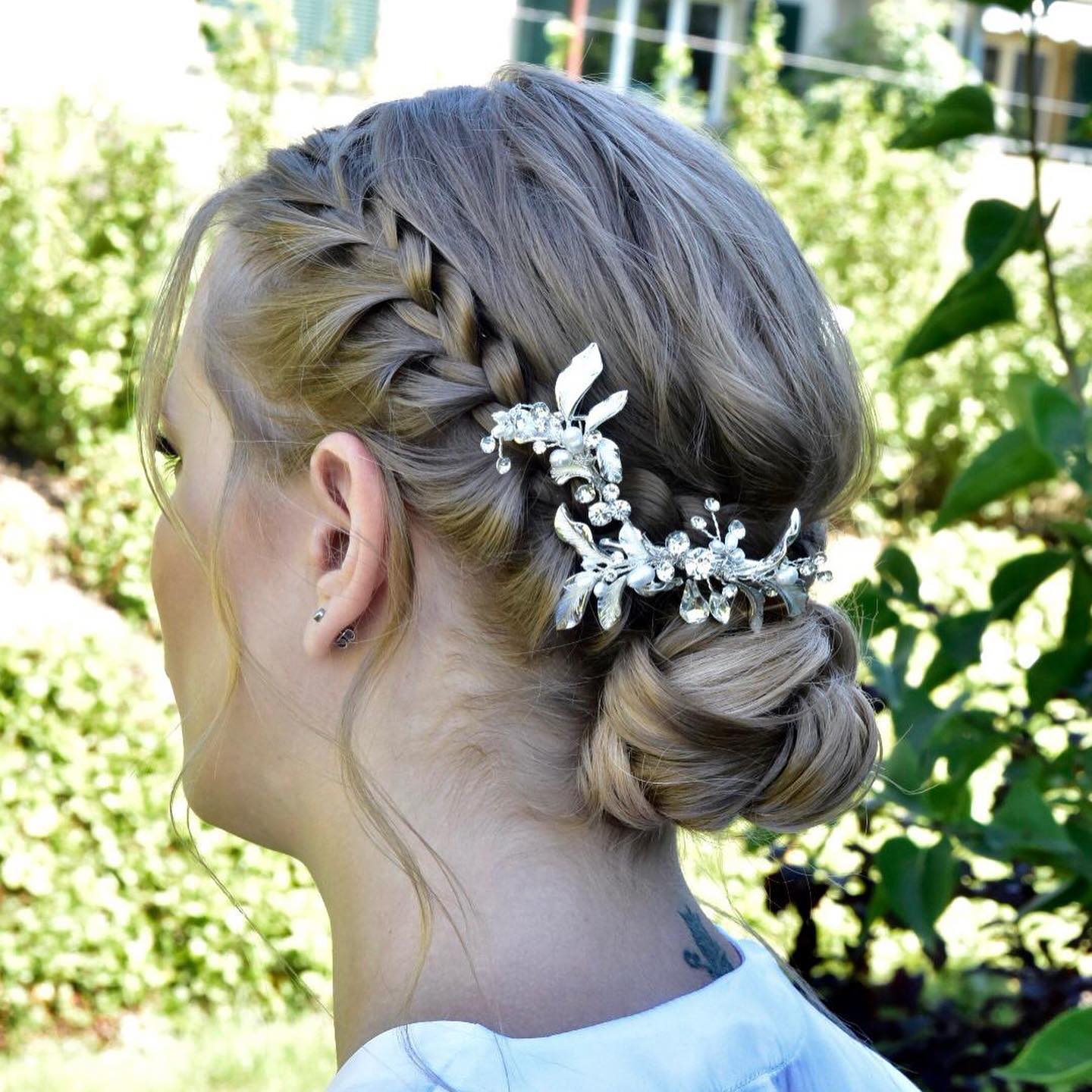 30. Elegantly Braided Bliss: a Twisted Updo with Gilded Accents