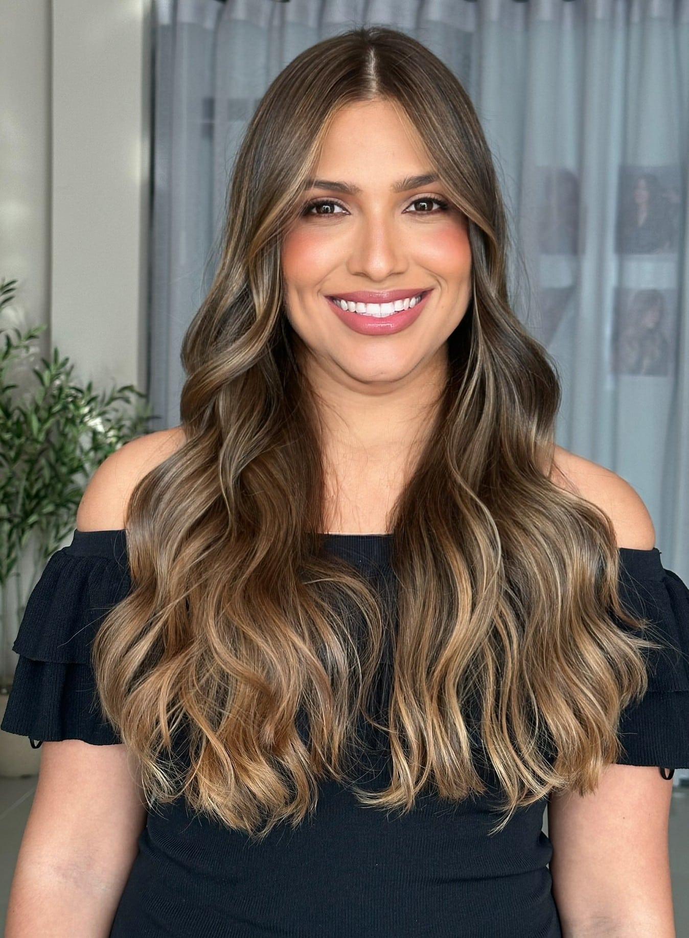 11. Title: Sun-Kissed Dark Brown Waves with Caramel Highlights