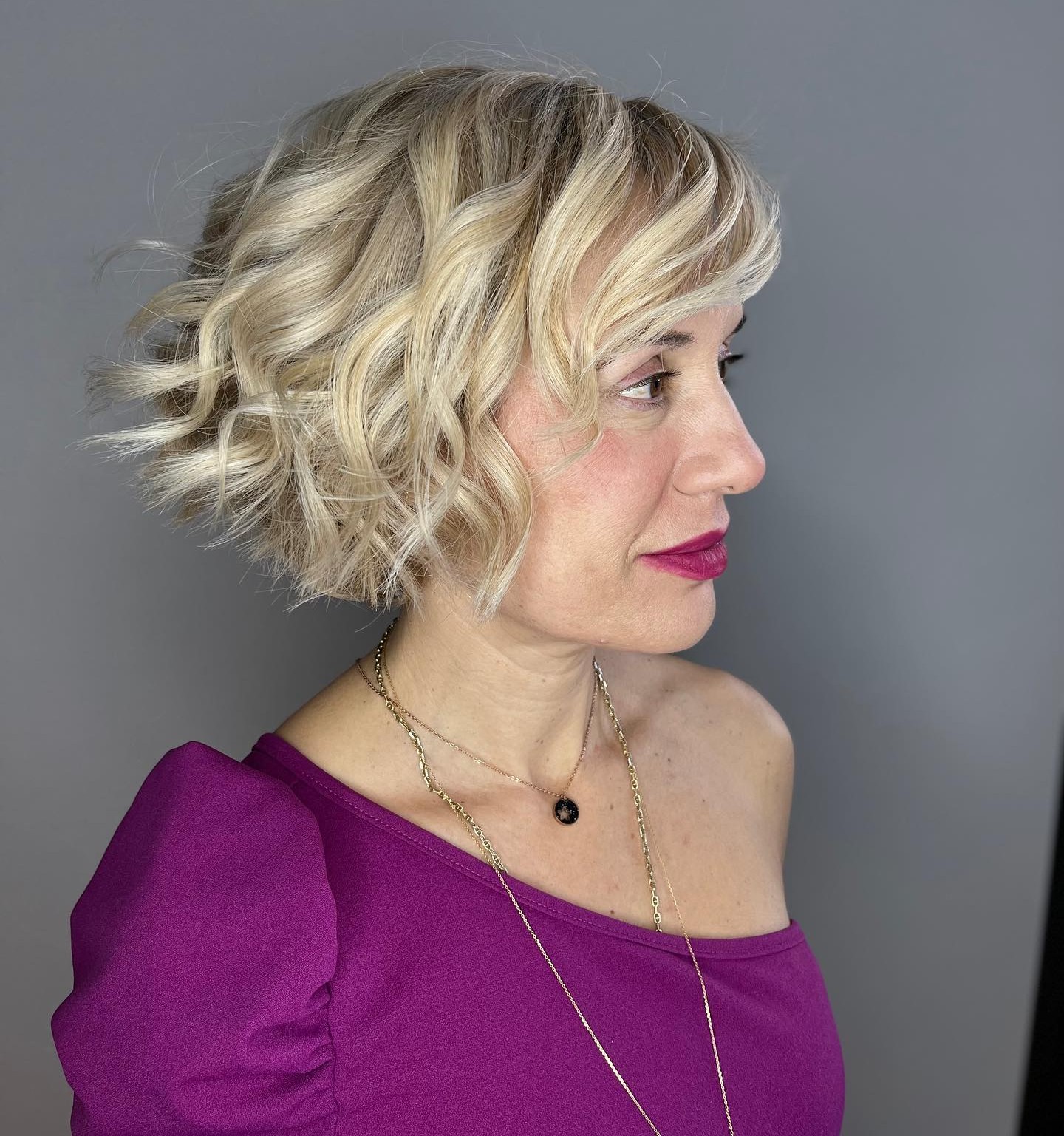 17. Textured Blonde Bob with Playful Waves