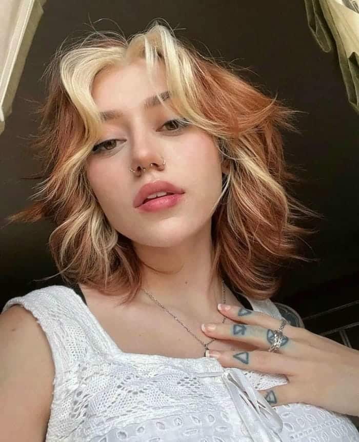 52. Title: Multi-tonal Choppy Bob with Bold Face-Framing Highlights