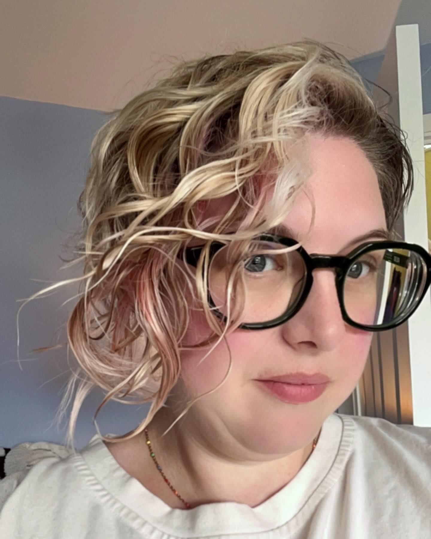 8. Title: Short, Playful Wavy Bob with Subtle Color Highlights