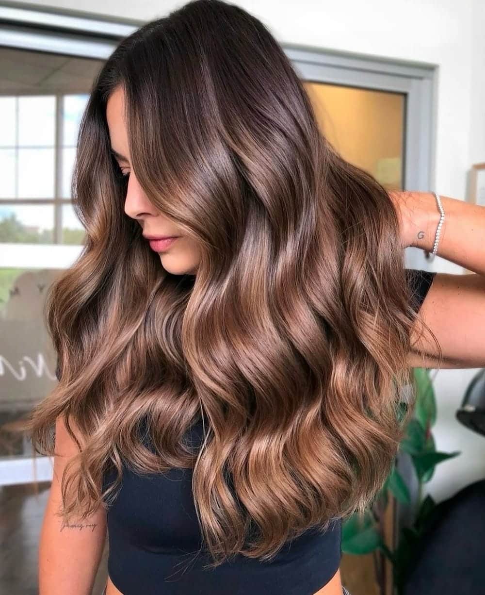 13. Rich Light Brown Hair with Radiant Highlights and Subtle Lowlights