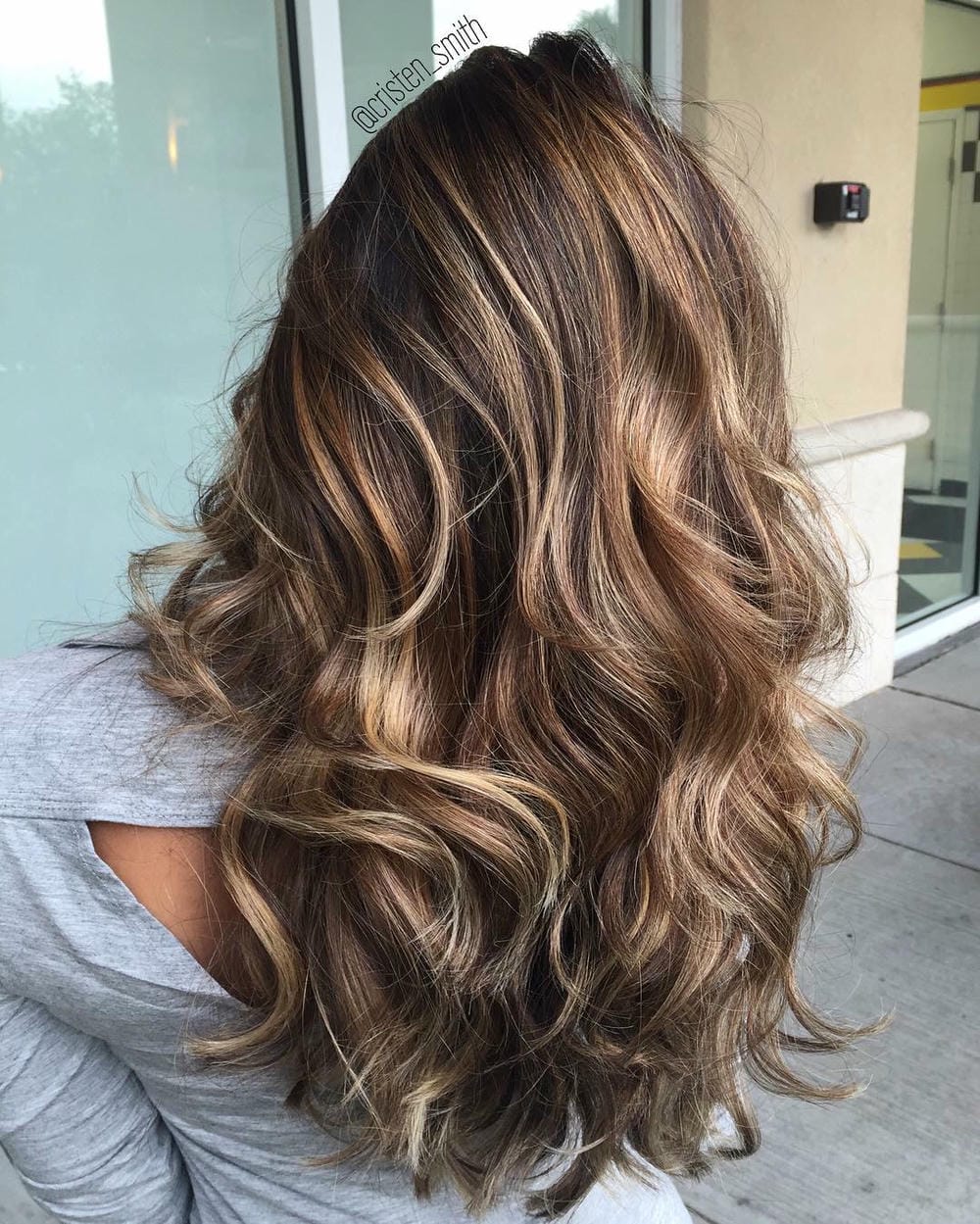 11. Sun-Kissed Waves with Gold and Caramel Highlights