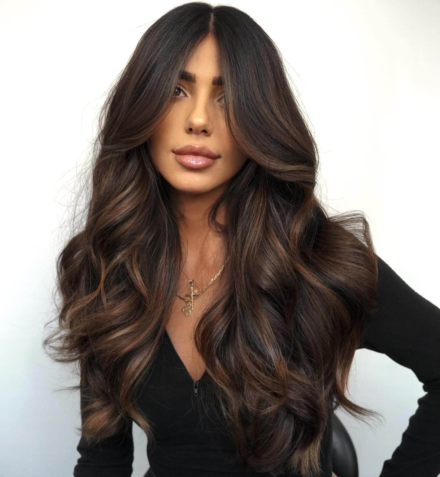 10. Title: Rich Dark Brown Locks with Sun-Kissed Highlights