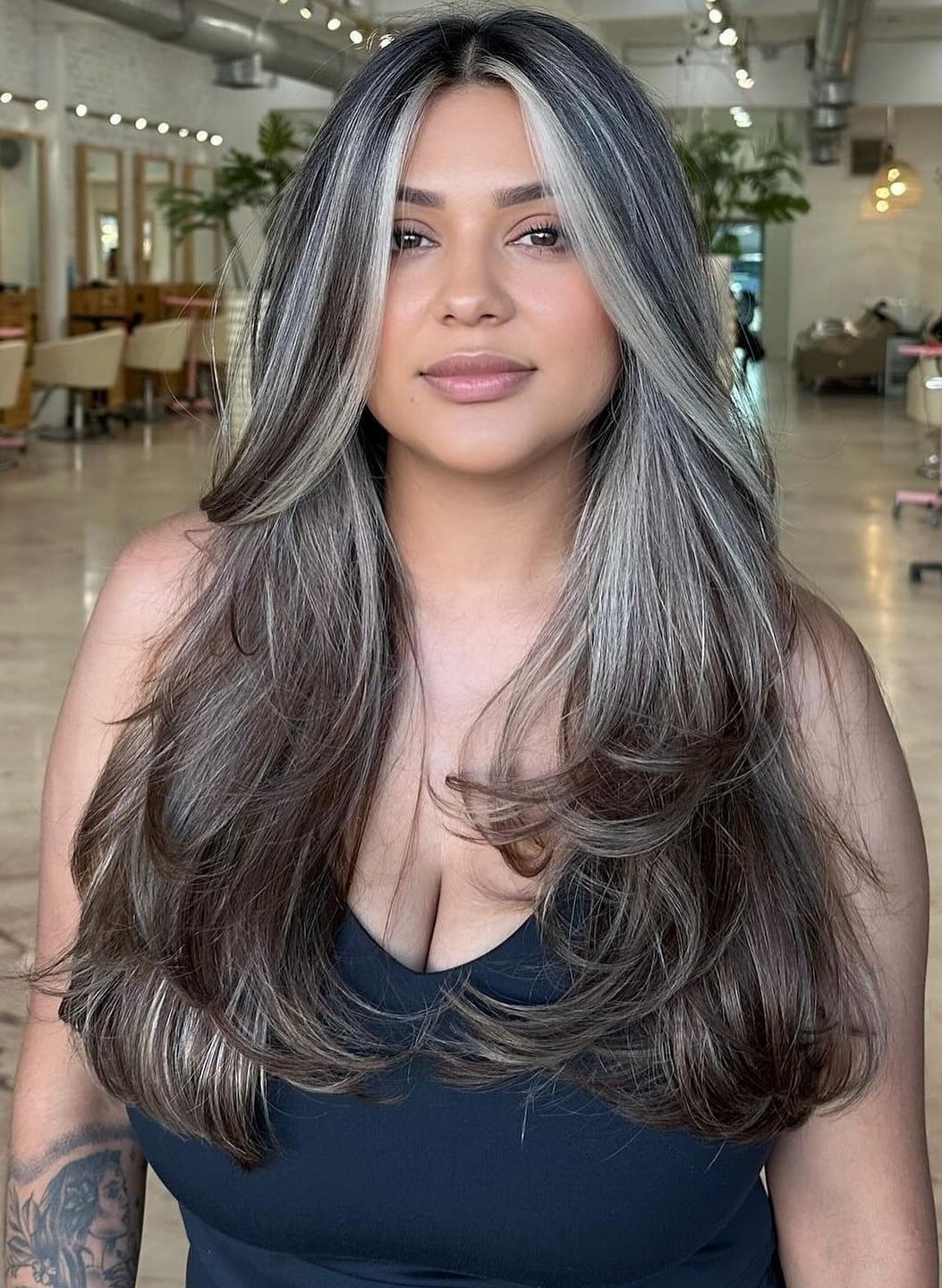 47. Title: Rich Dark Brown Hair with Striking Platinum Highlights