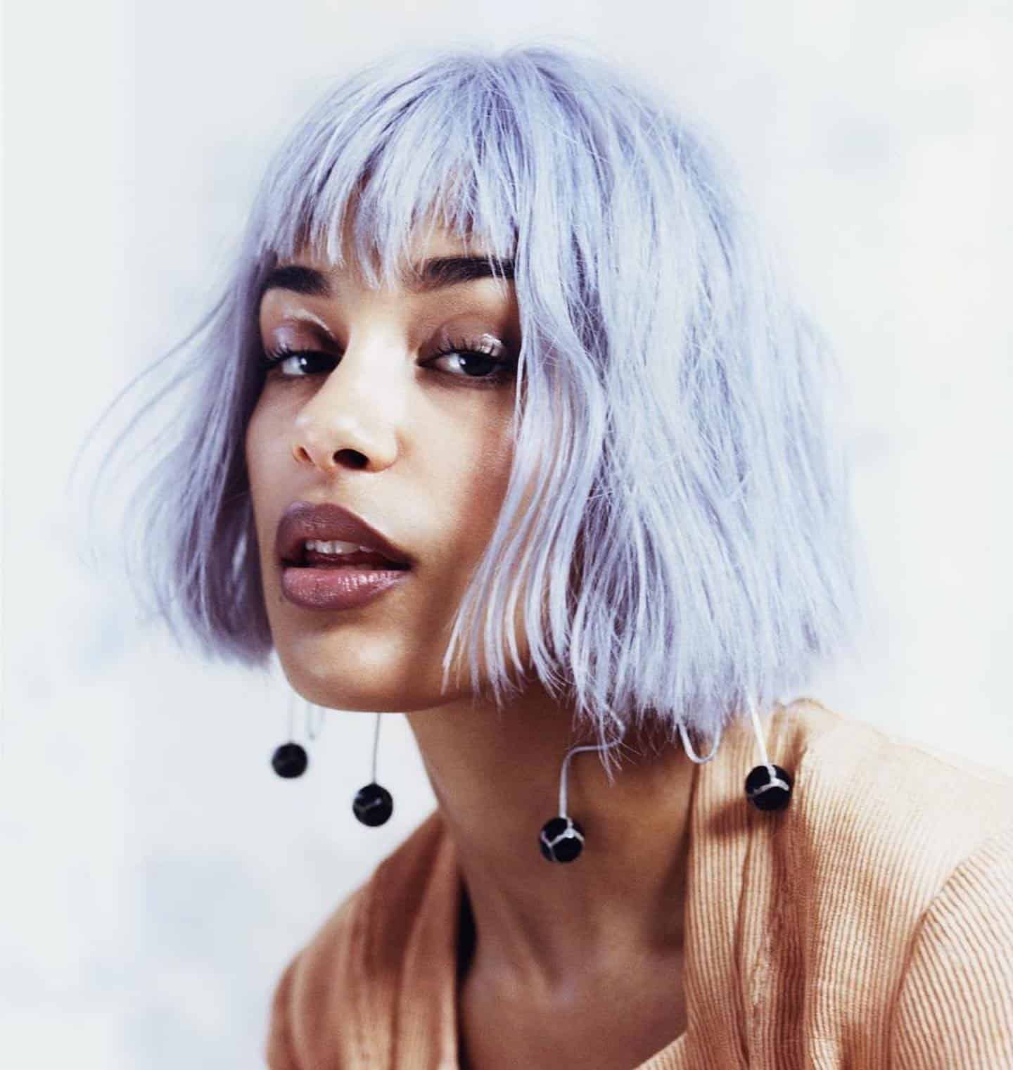 61. Pastel Wavy Bob with Blunt Bangs