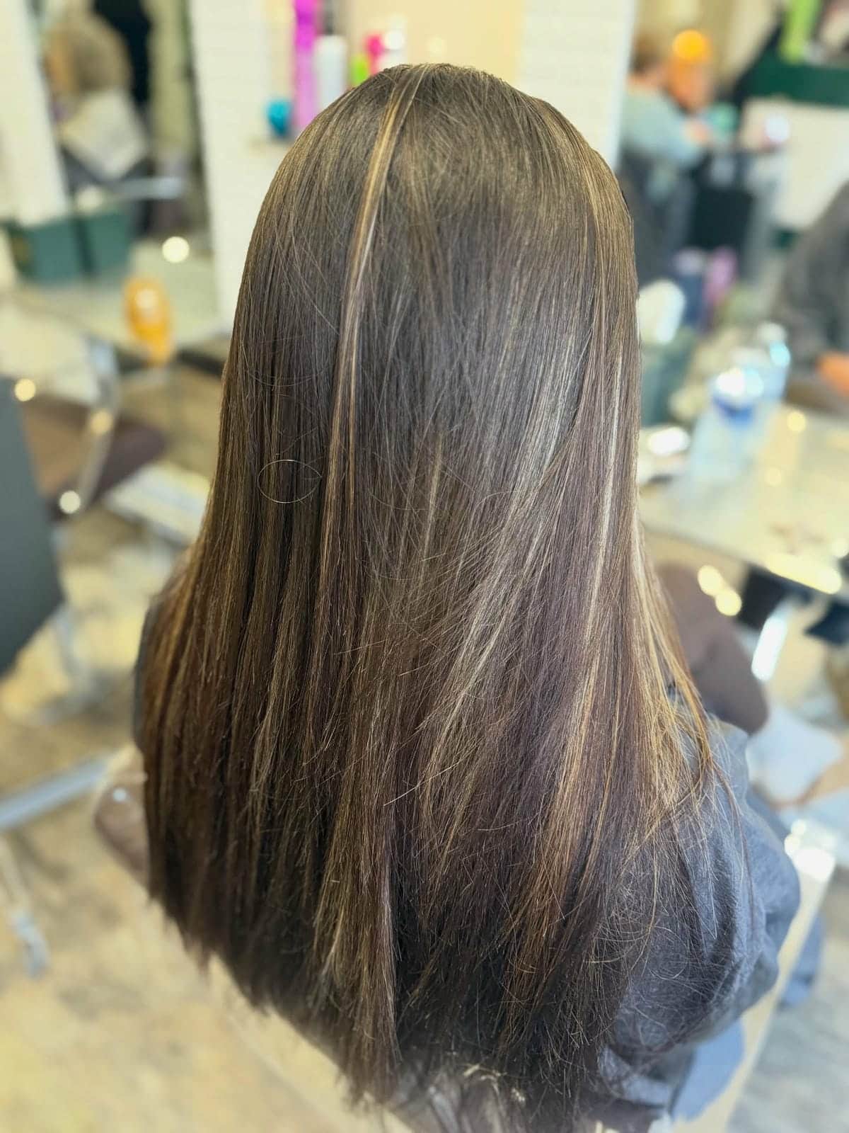 20. Title: Chocolate Brown Hair with Subtle Blonde Highlights