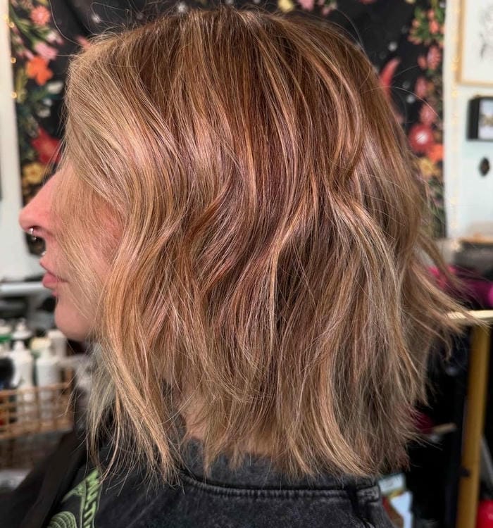 73. Textured Choppy Bob with Warm Highlights