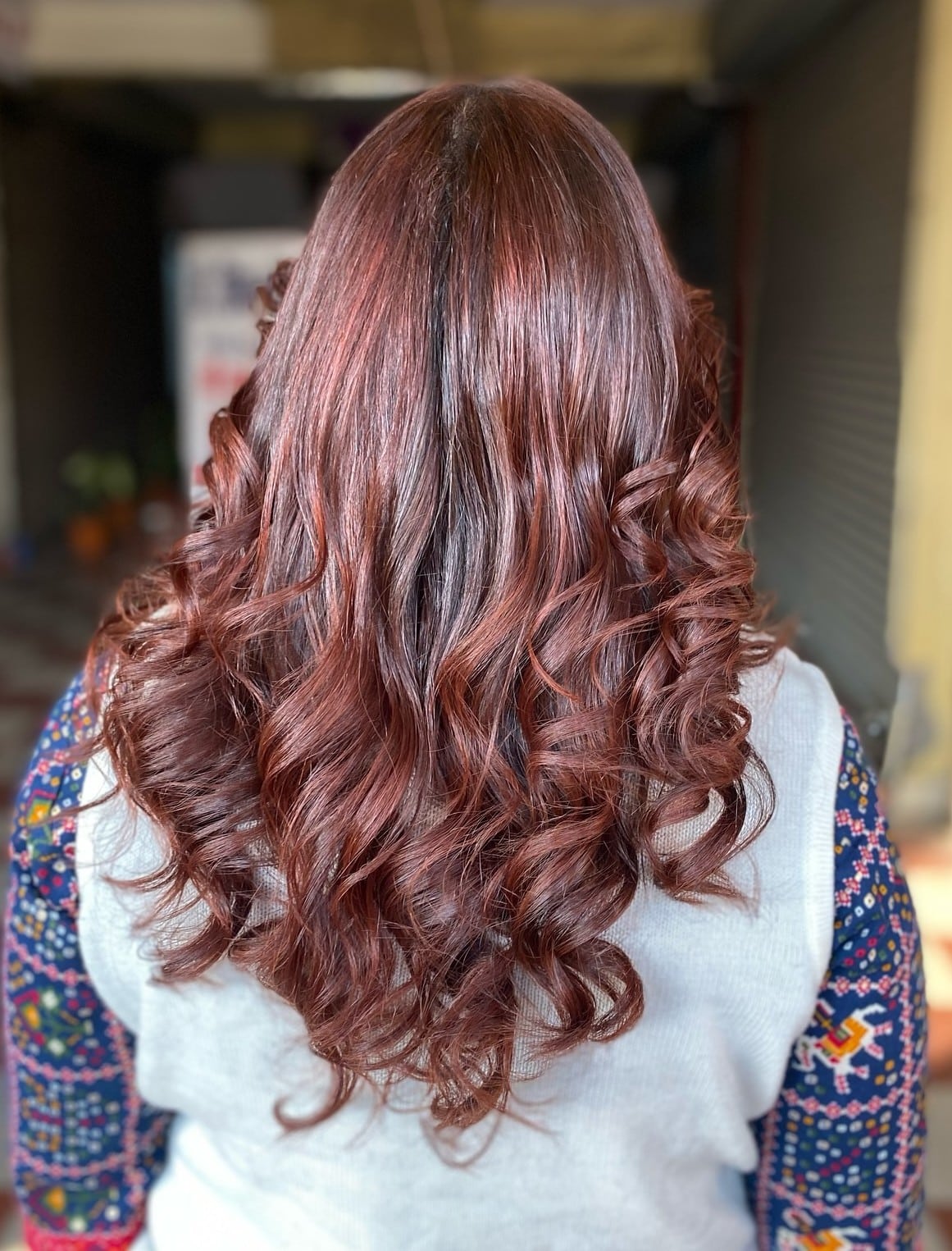 35. Flowing Dark Brown Curls with Subtle Highlights