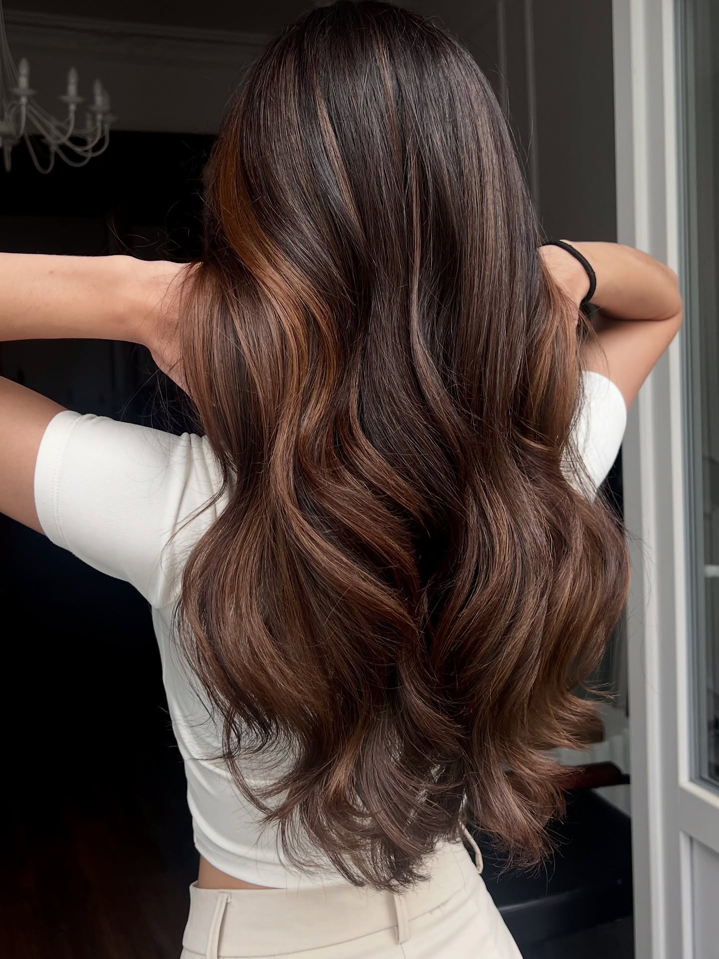 7. Dark Brown Hair with Subtle Caramel Highlights