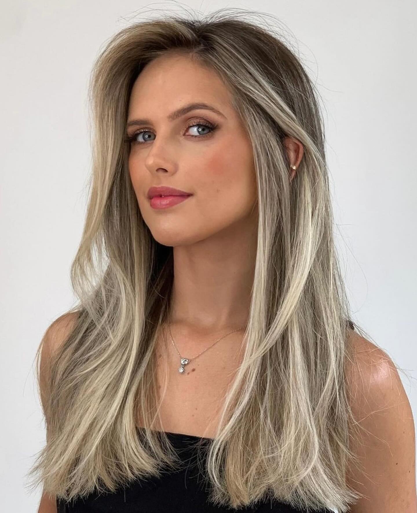 56. Soft Layers with Subtle Blonde Highlights