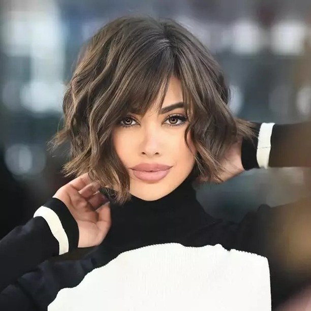 59. Soft Wavy Bob with Blunt Fringe