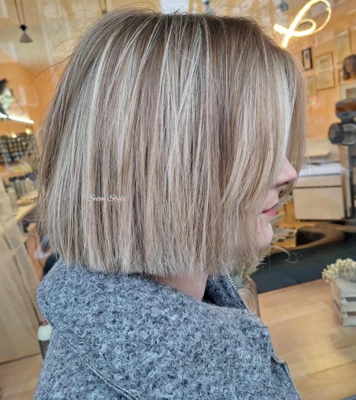 74. Title: Textured Choppy Bob with Blonde Highlights