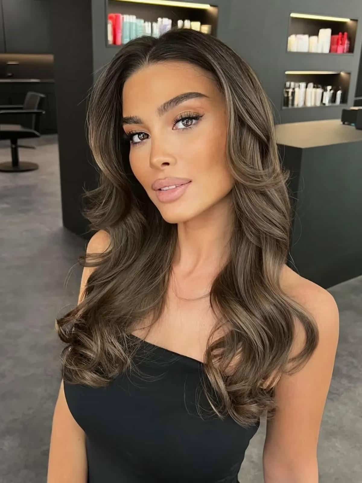 9. Title: Warm Chocolate Brown Waves with Soft Highlights