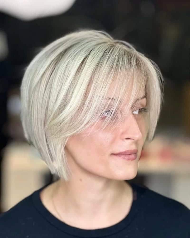 3. Textured Blunt Bob with Side Swept Bangs