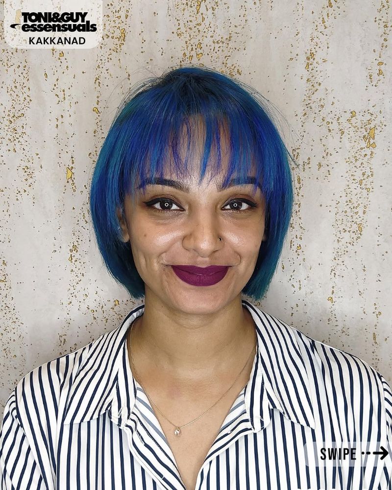 45. Bright Blue Short Choppy Hairstyle with Bangs