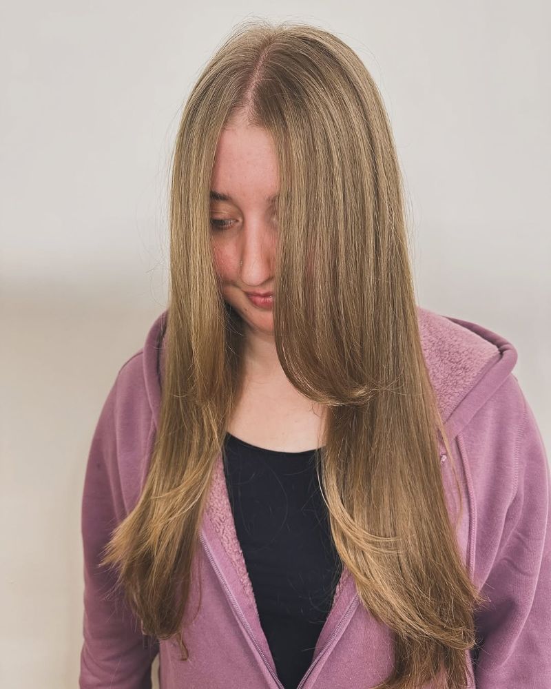 58. Long Layered Cut with Side-Swept Bangs
