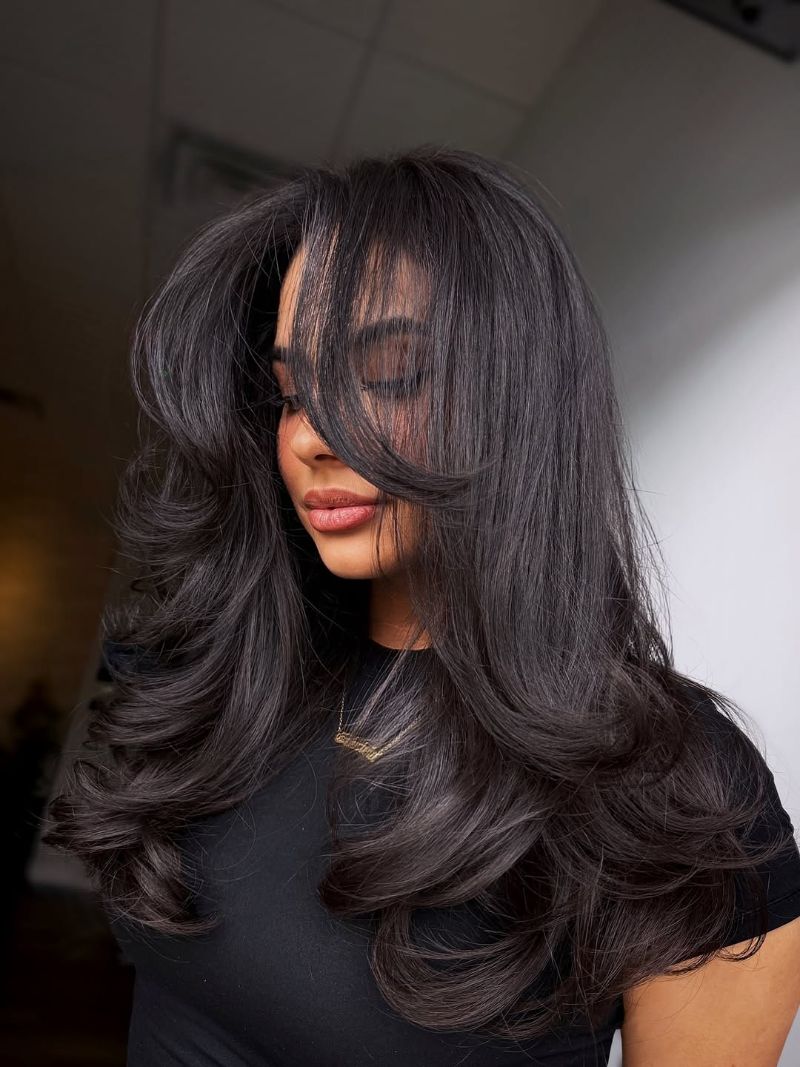 49. Long, Voluminous Layers with Subtle Bangs