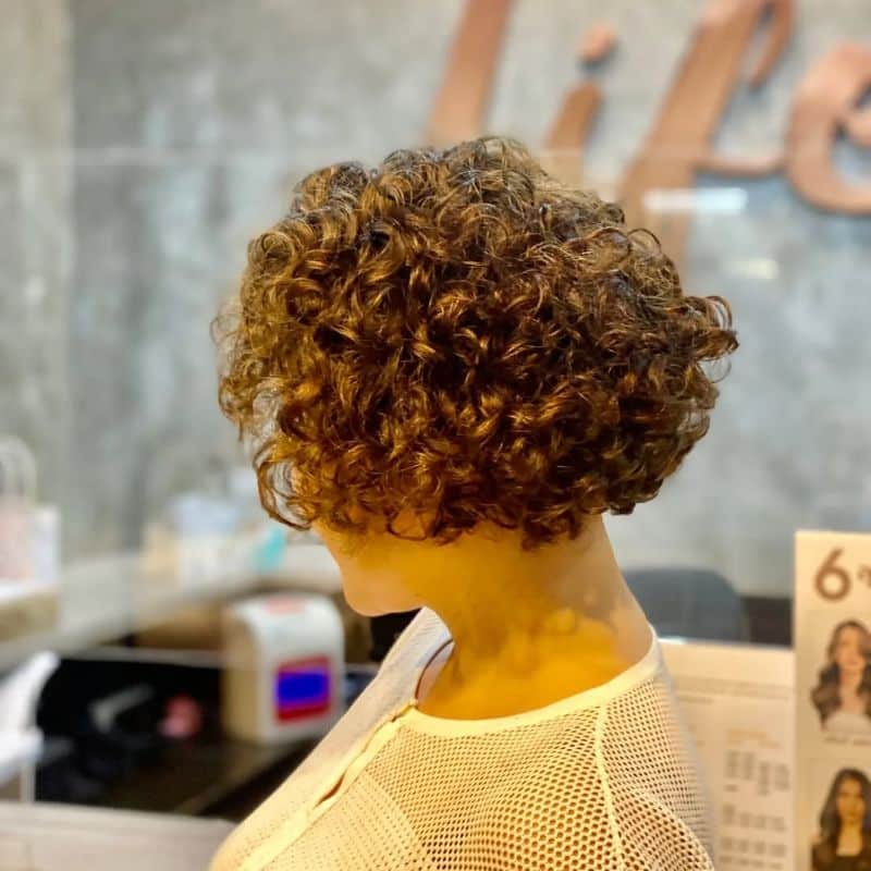 61. Playful Curly Bob with Volume
